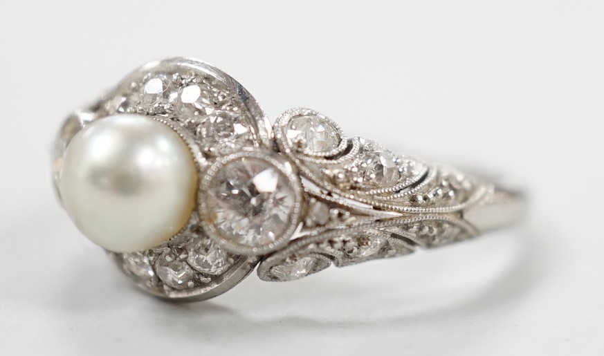 A white metal(stamped Platin), cultured pearl and diamond set circular cluster ring, size M, gross weight 5 grams.
